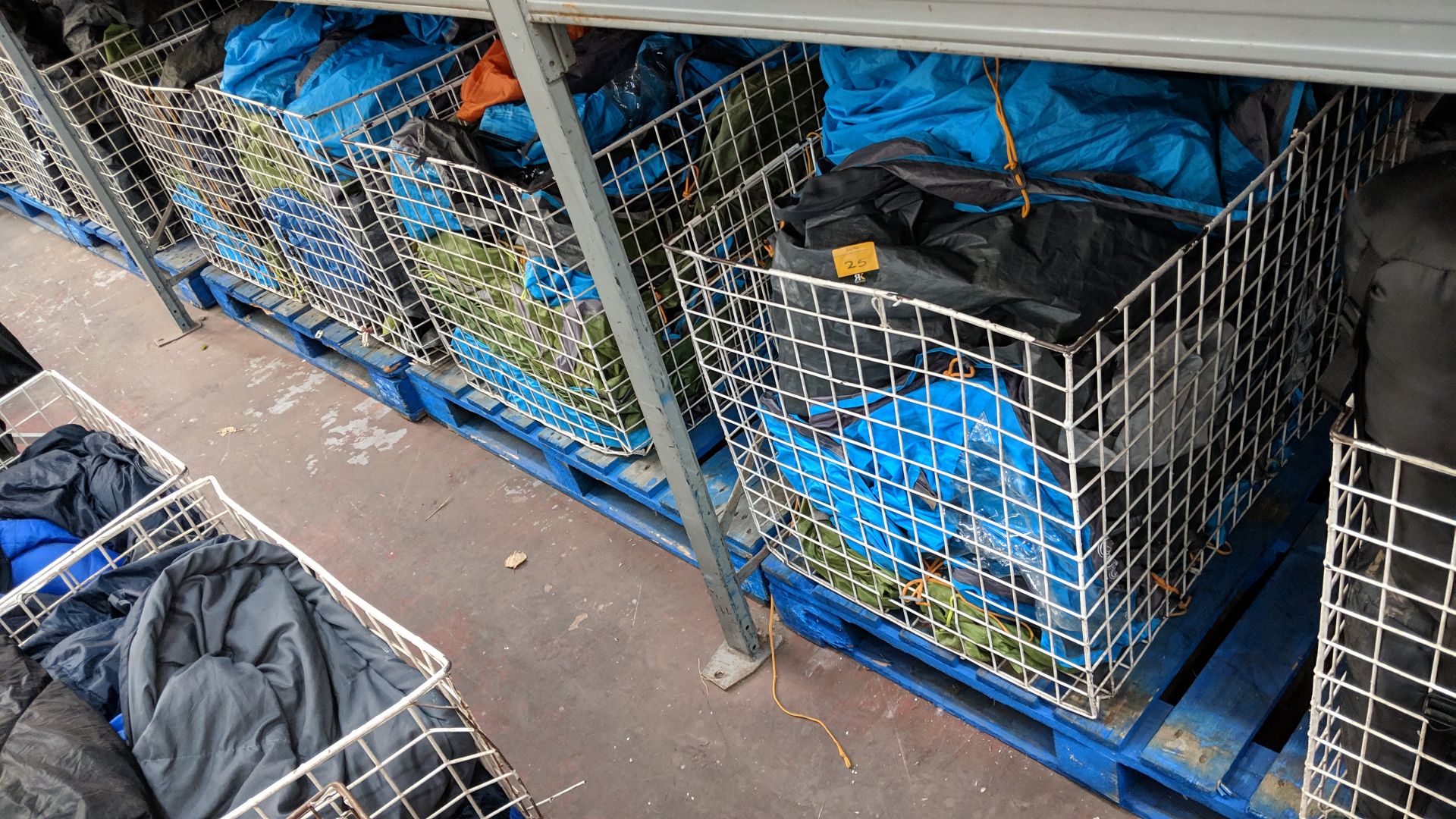 Contents of 5 large cages of assorted groundsheets, tarps & other camping related items - cages