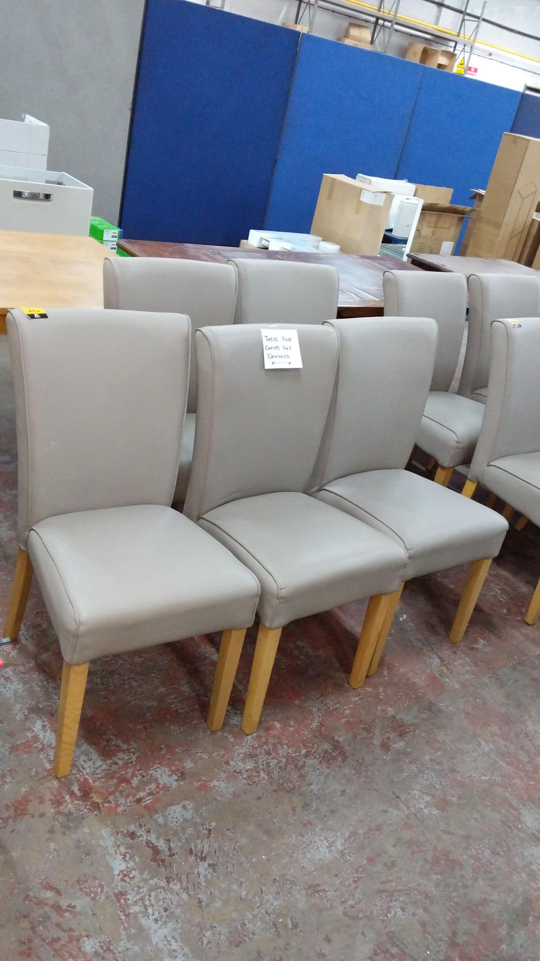 5 off dining chairs with wooden legs, upholstered in taupe leatherette type fabric, understood to