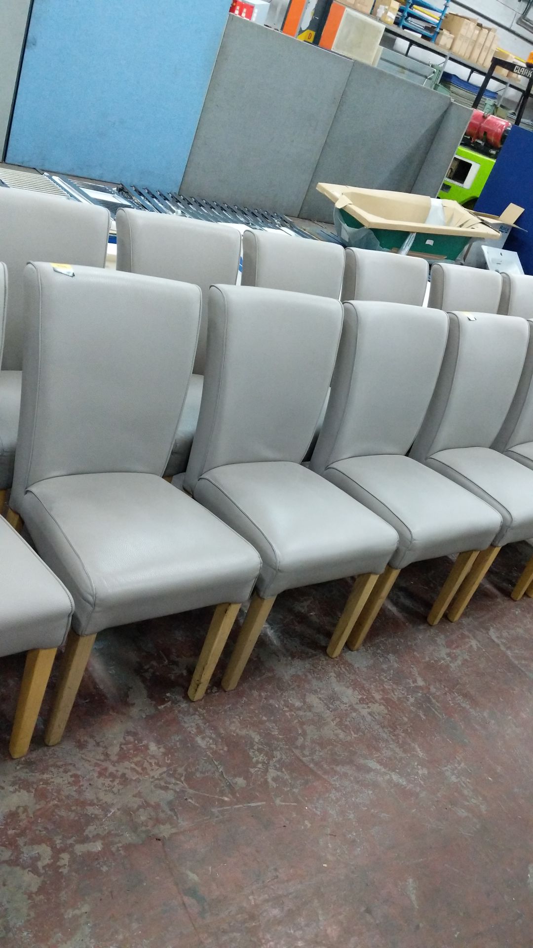 6 off dining chairs with wooden legs, upholstered in taupe leatherette type fabric, understood to