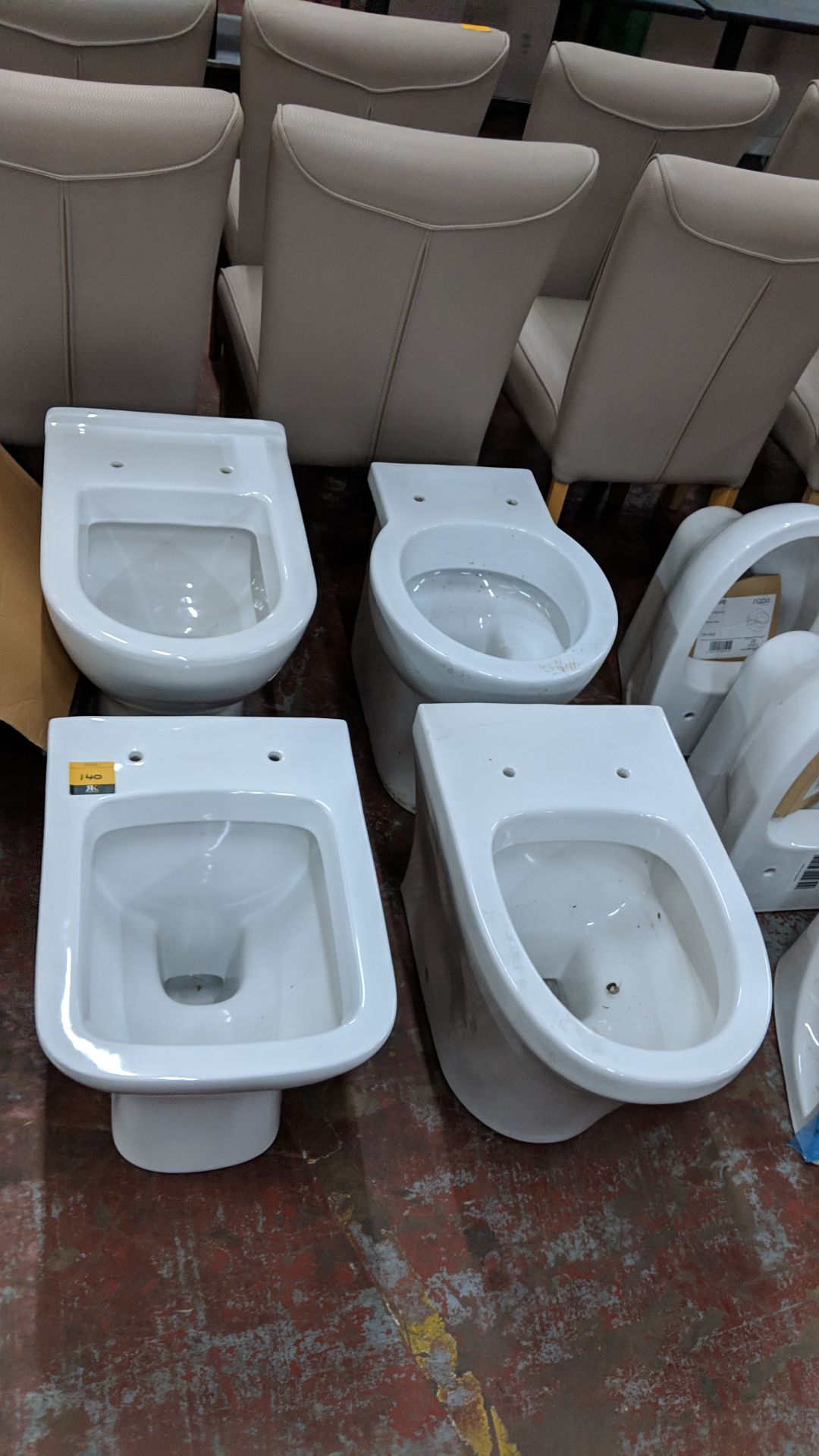 4 off assorted back-to-wall WC pans Lots 100 - 142 & 146 - 167 are being sold on behalf of a