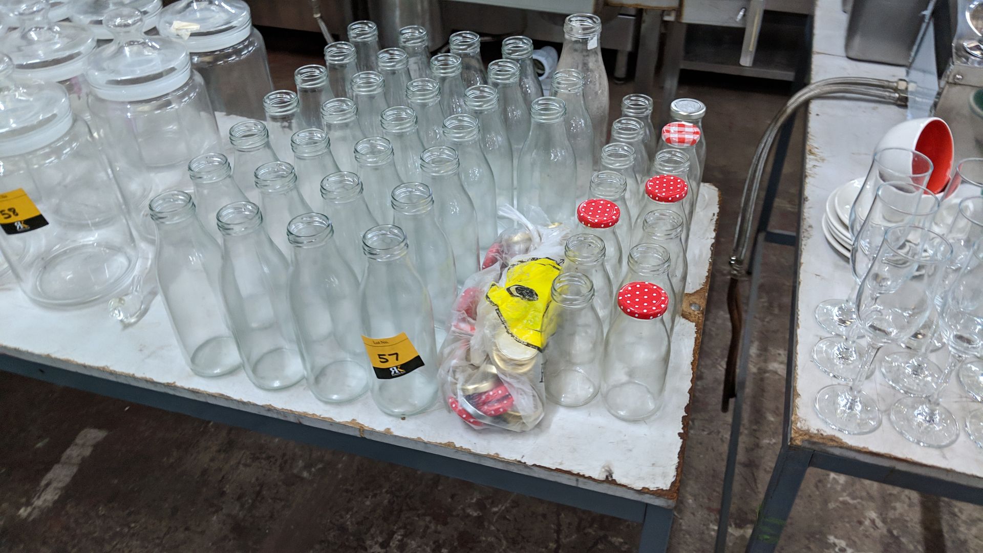Quantity of assorted size glass bottles & lids IMPORTANT: Please remember goods successfully bid