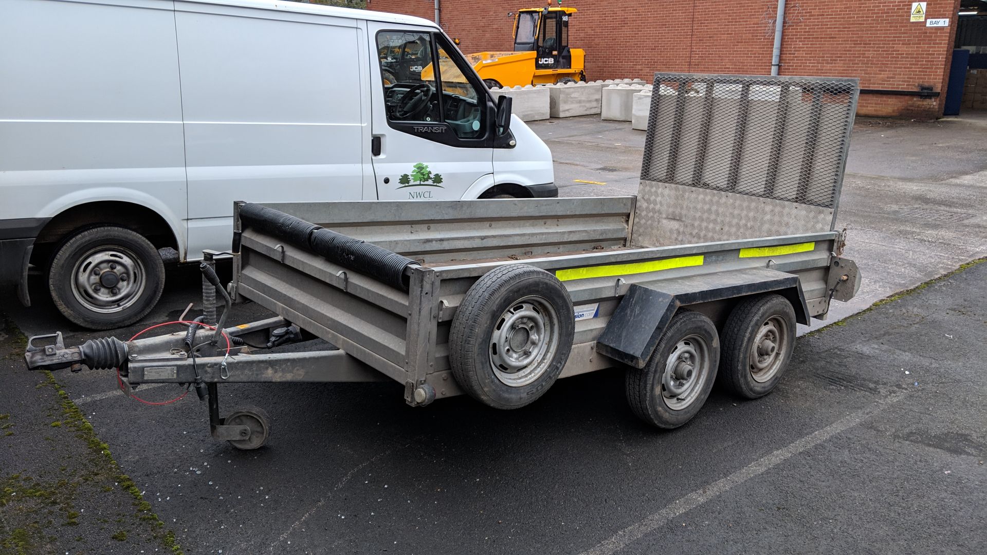 Indespension 2600kg twin axle 10x5 trailer with fold down loading ramp at one end, marked Type V7 on