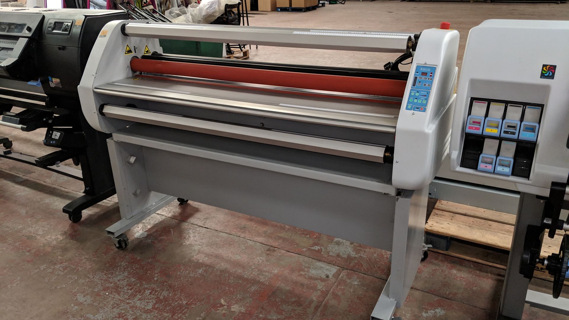 Kala floor standing laminator with foot pedal, circa 63 inch capacity. Assumed to be the Sirocco