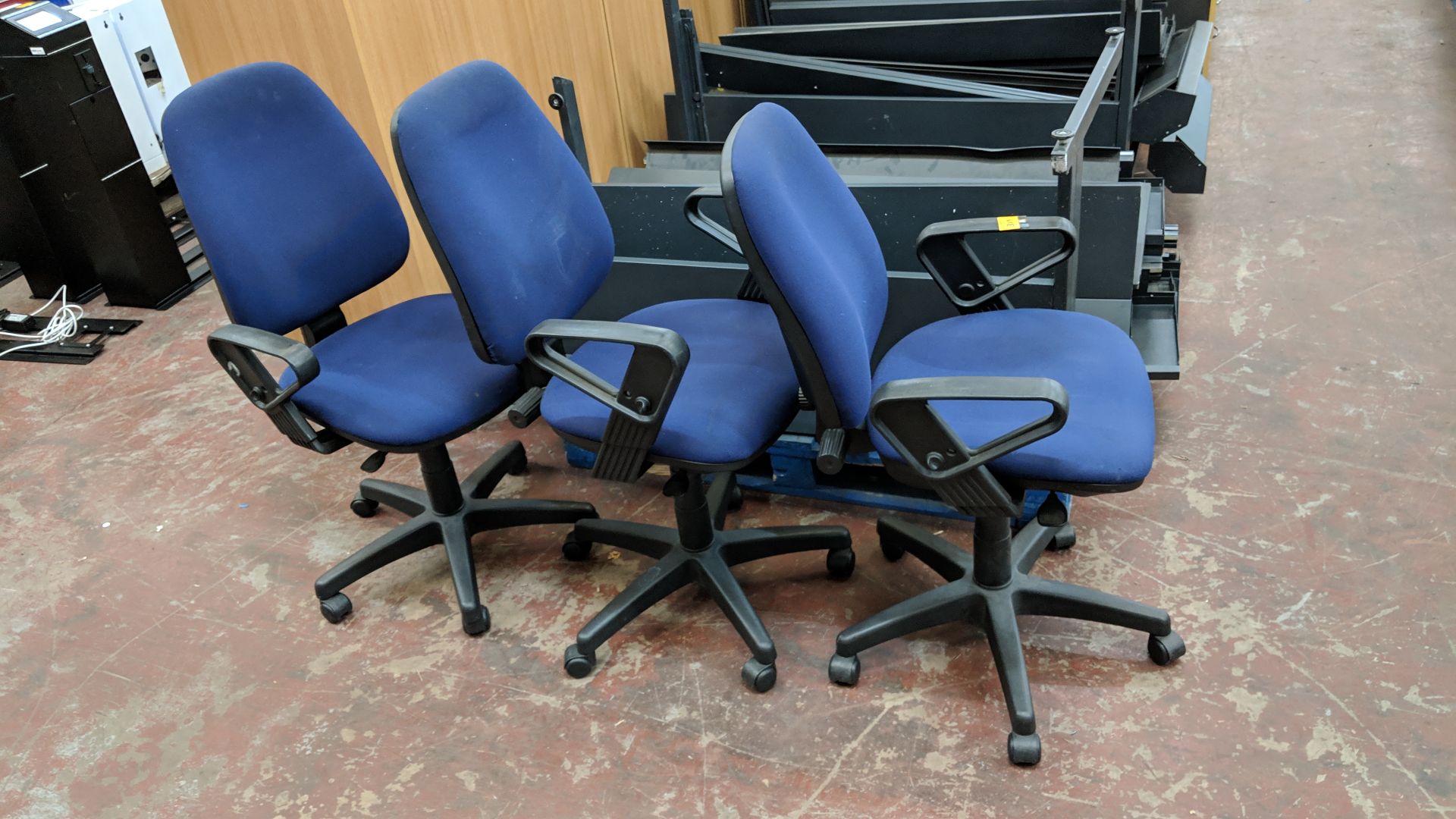 3 off matching dark blue upholstered operators' chairs with arms