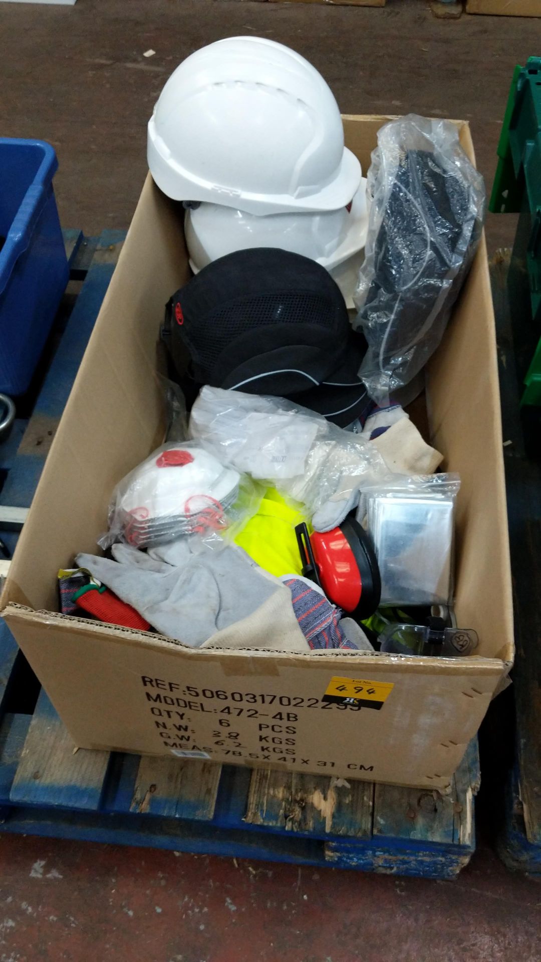 Box of assorted PPE equipment including hard hats, gloves, respiratory items, hard caps & more