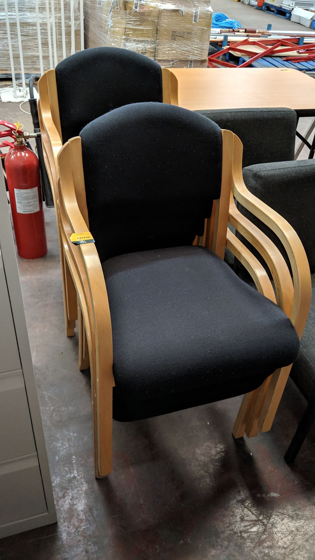 6 off matching stacking black tweed stand chairs on wood frames This lot is one of a number being