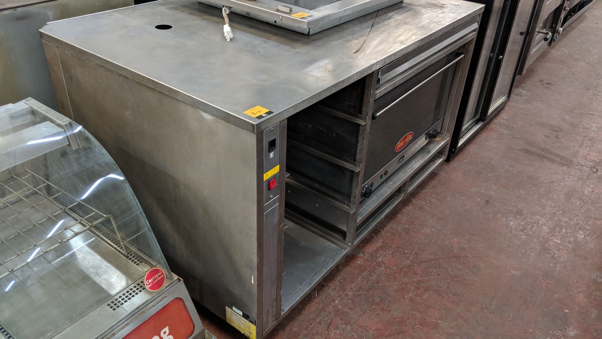 Large stainless steel unit comprising Uno X wide oven plus assorted built-in racking/shelving