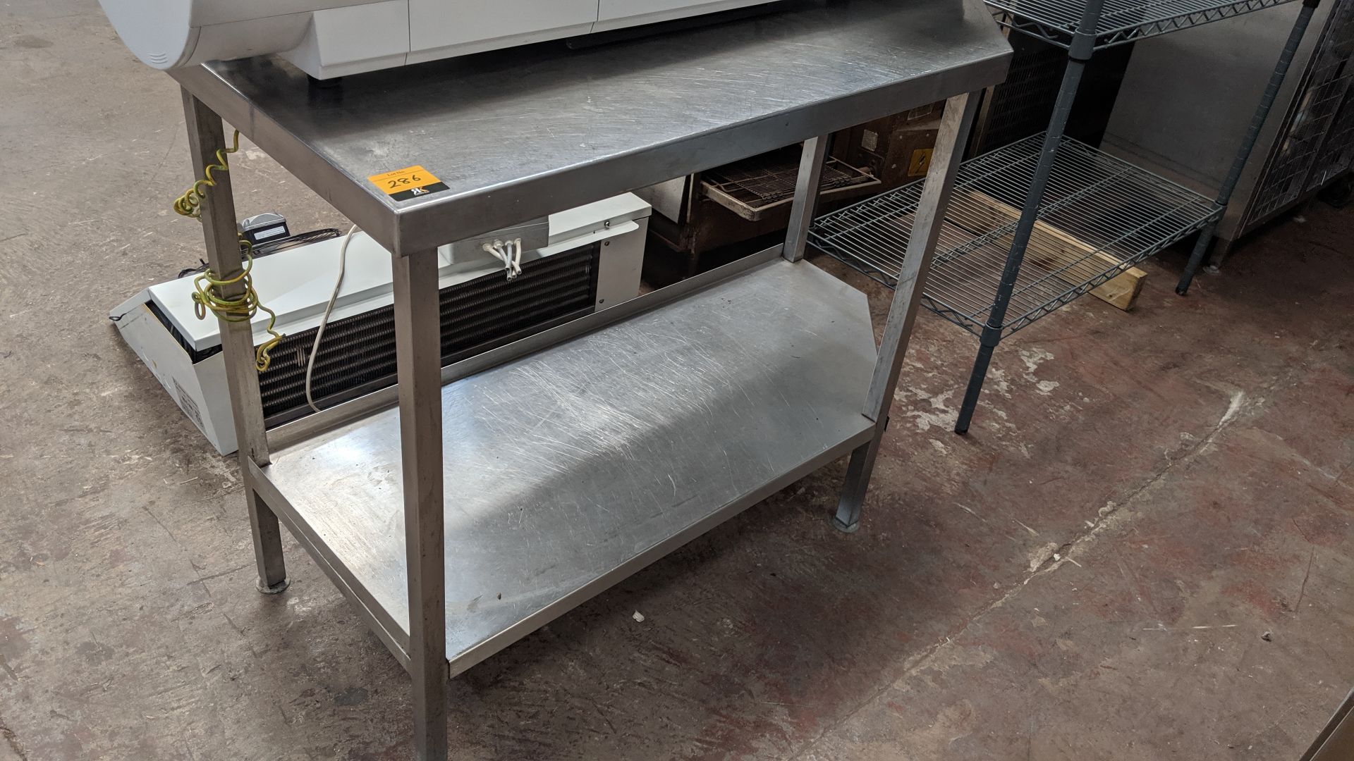 Stainless steel twin tier table IMPORTANT: Please remember goods successfully bid upon must be