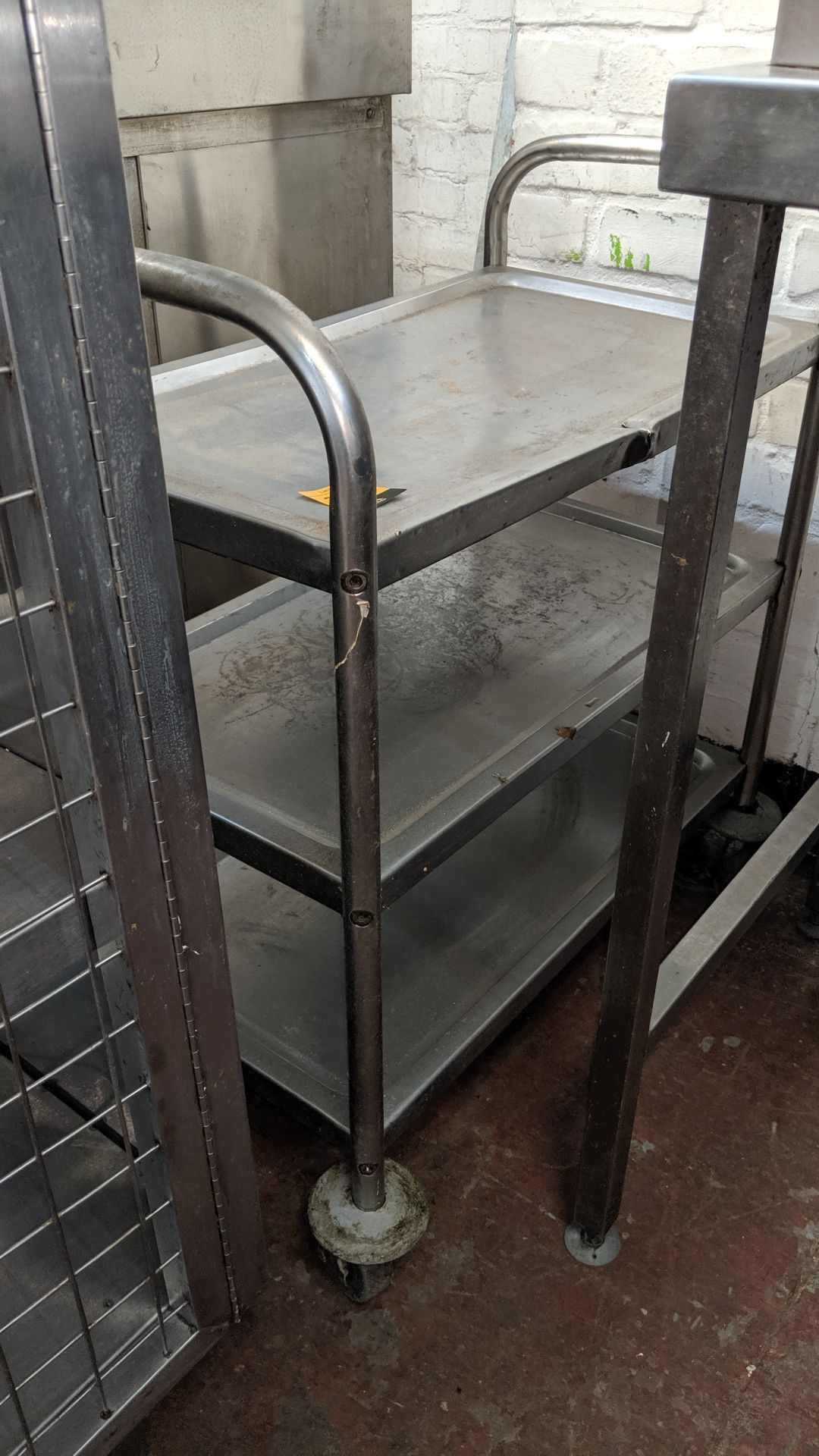 Stainless steel triple tier trolley IMPORTANT: Please remember goods successfully bid upon must be