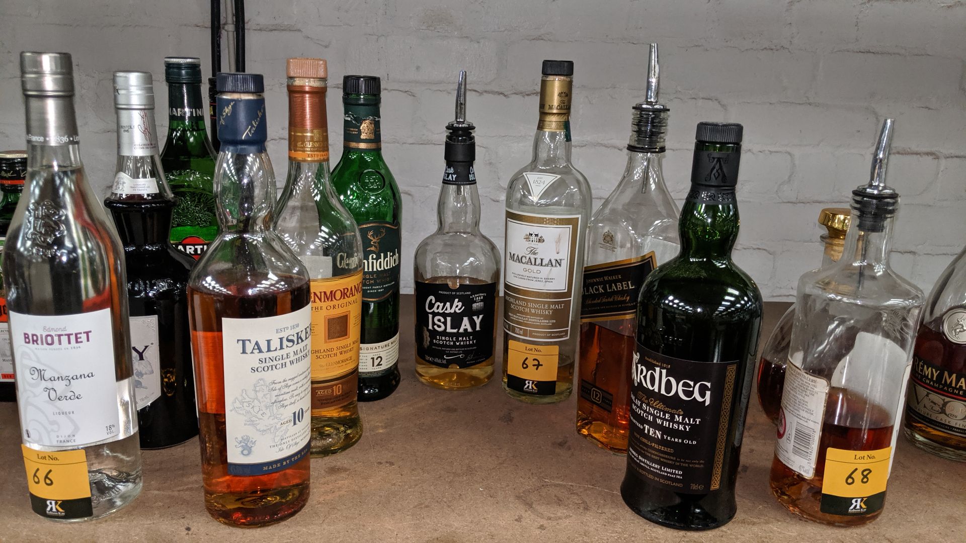 7 assorted opened bottles of Scottish whisky including Ardbeg, Talisker, Glenmorangie & others