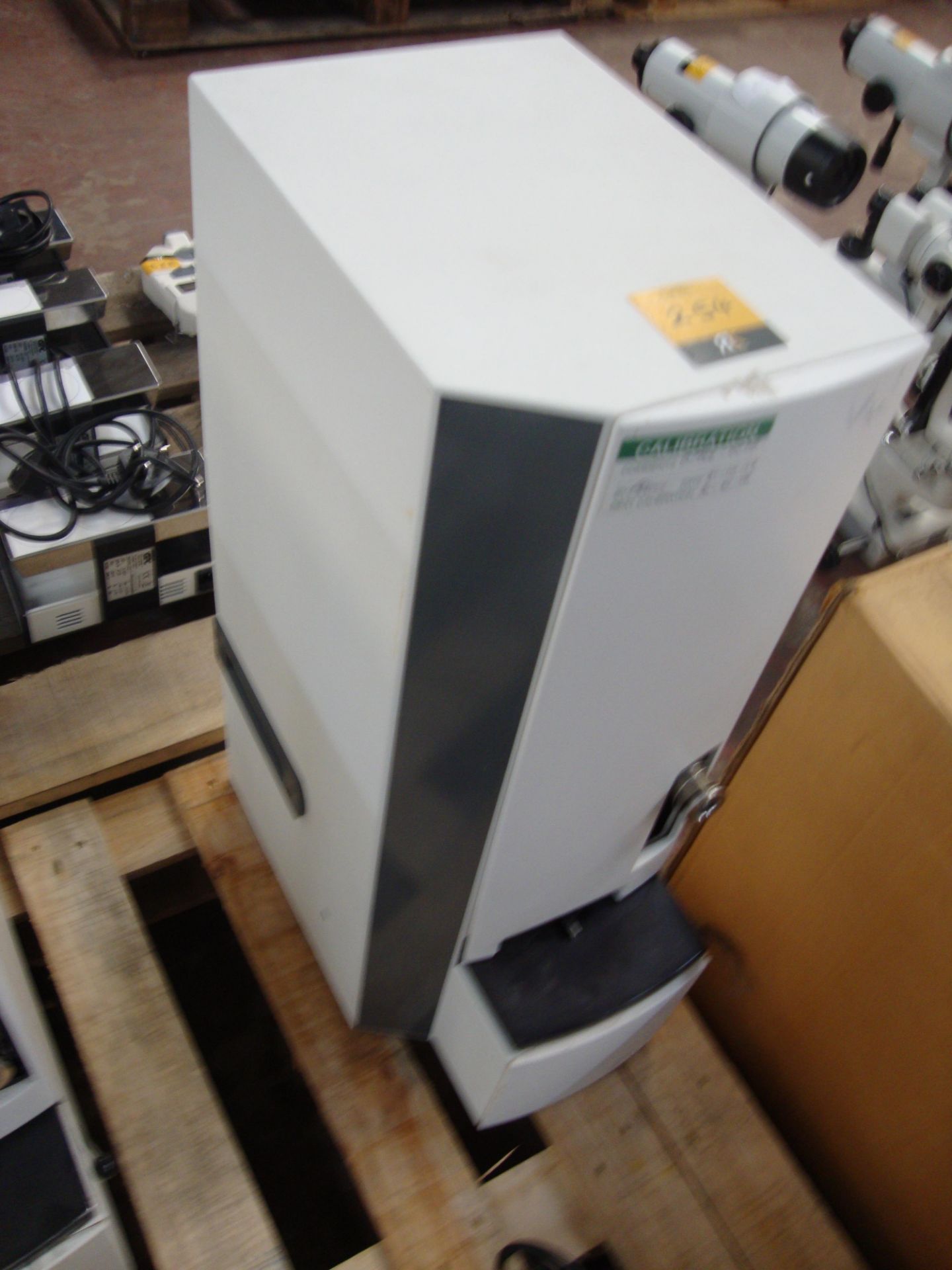Automatic lens blocking machine All the lots in this auction are being sold on behalf of Galaxy
