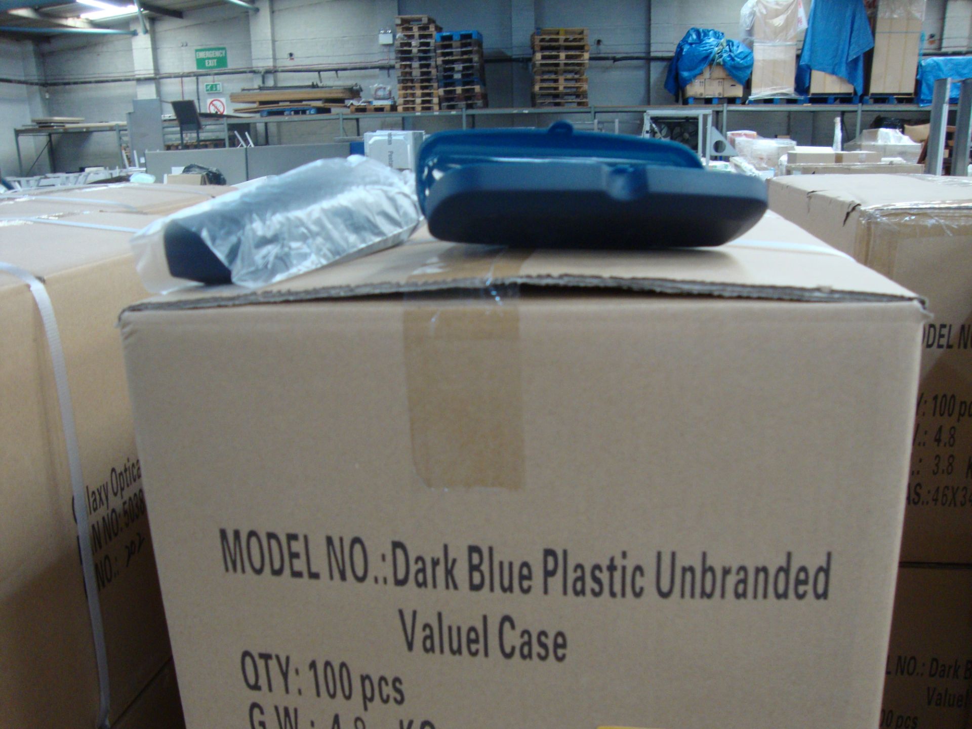 20 boxes containing a total of 2,000 dark blue plastic unbranded glasses/sunglasses cases All the