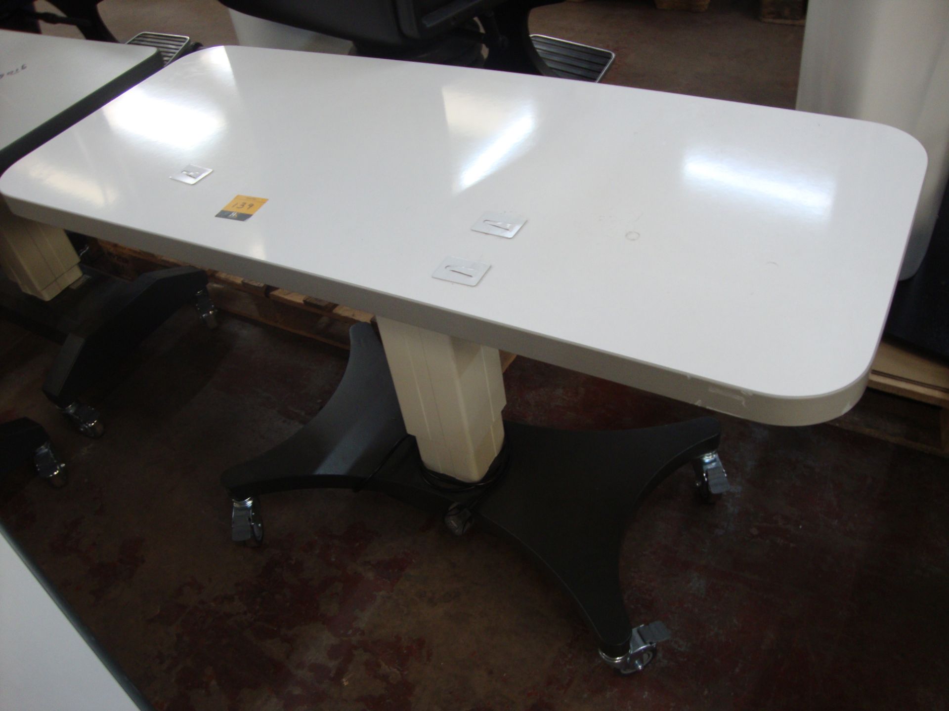 Electric motorized rising table 1200mm x 500mm All the lots in this auction are being sold on behalf