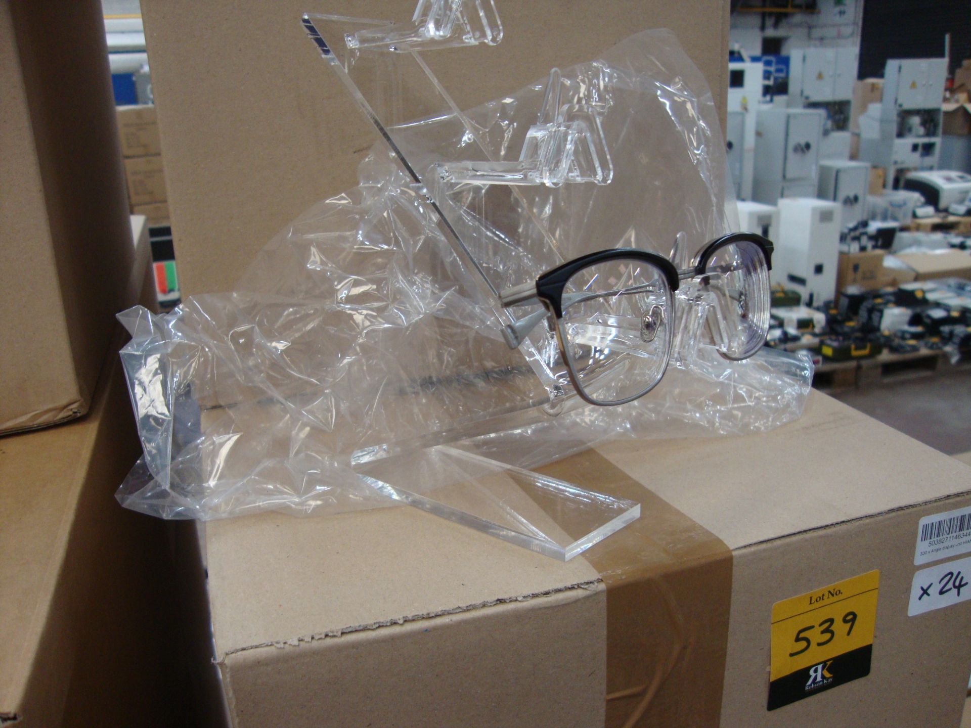 9 boxes containing a total of approx. 105 acrylic freestanding display stands capable of