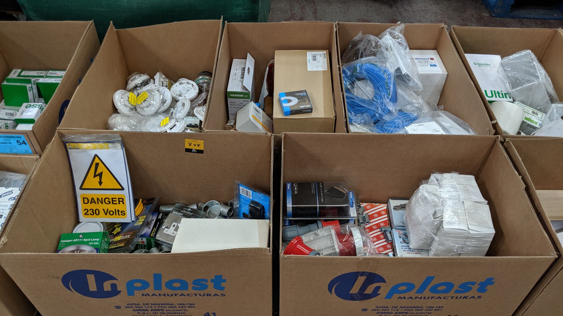 Contents of a pallet of assorted lighting, switches, cable, back boxes, junction boxes and more -