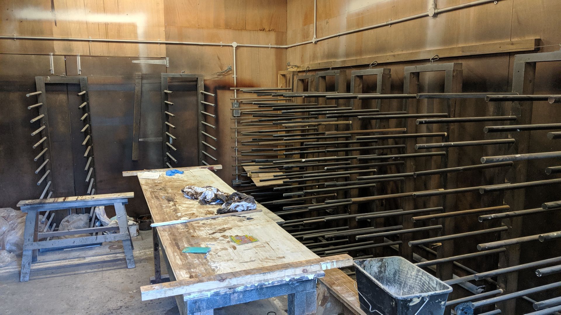 Contents of a paint drying room including approx. 14 drying racks, wooden trestles, 2 off metal