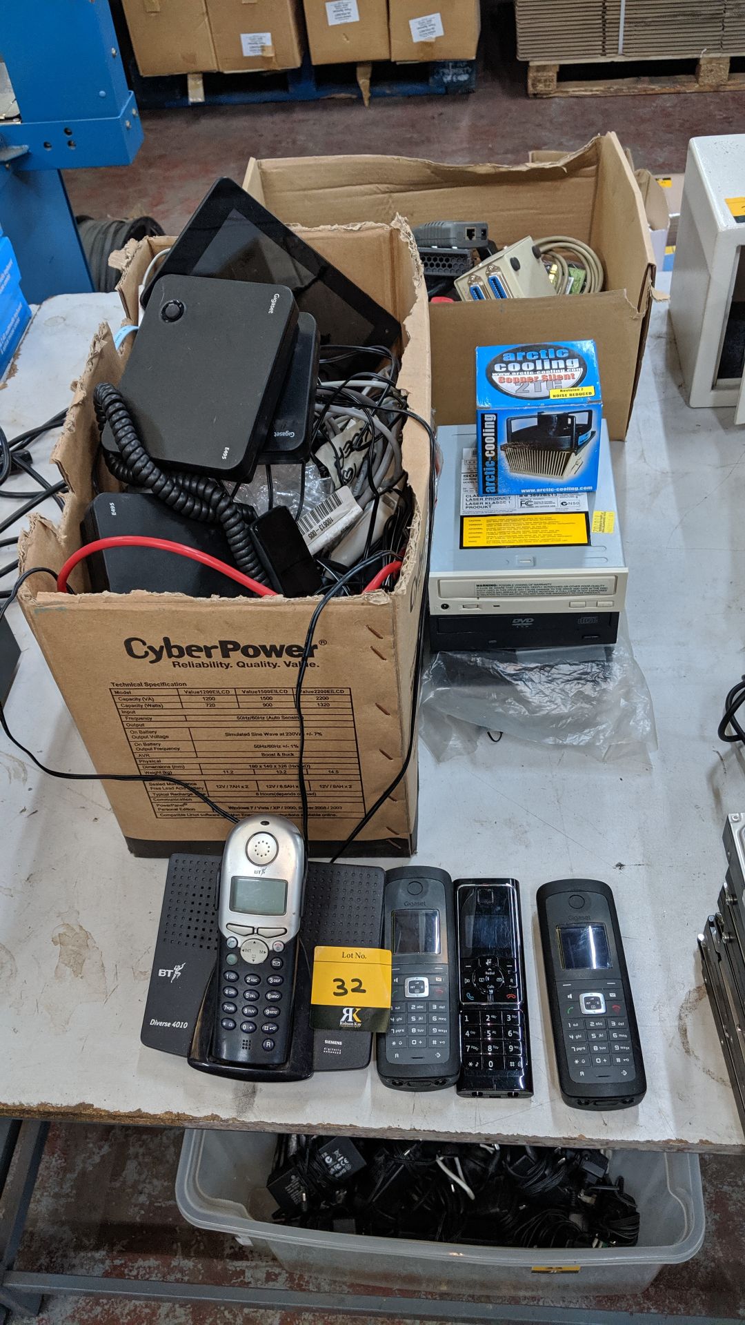 Row of assorted telephone, computer & other electrical items. This is one of a number of lots