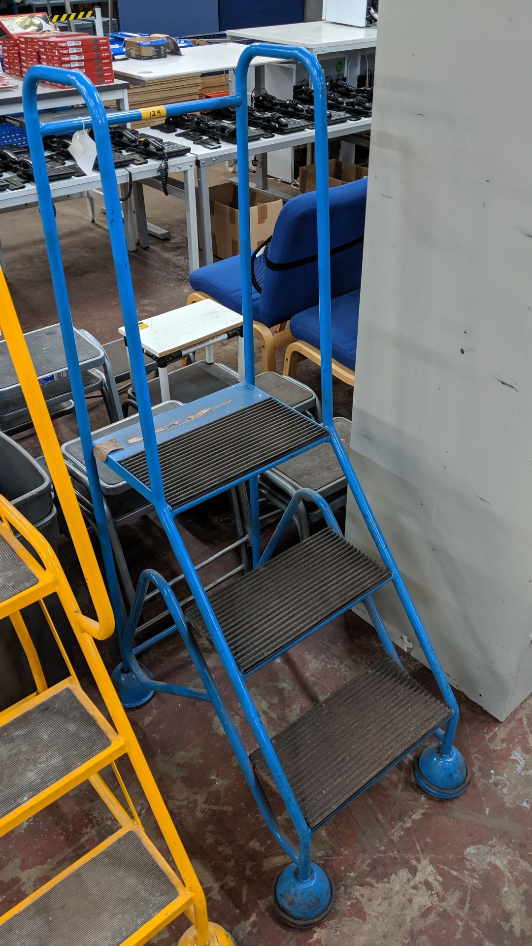 Blue mobile metal access/mini library steps. This is one of a large number of lots being sold on
