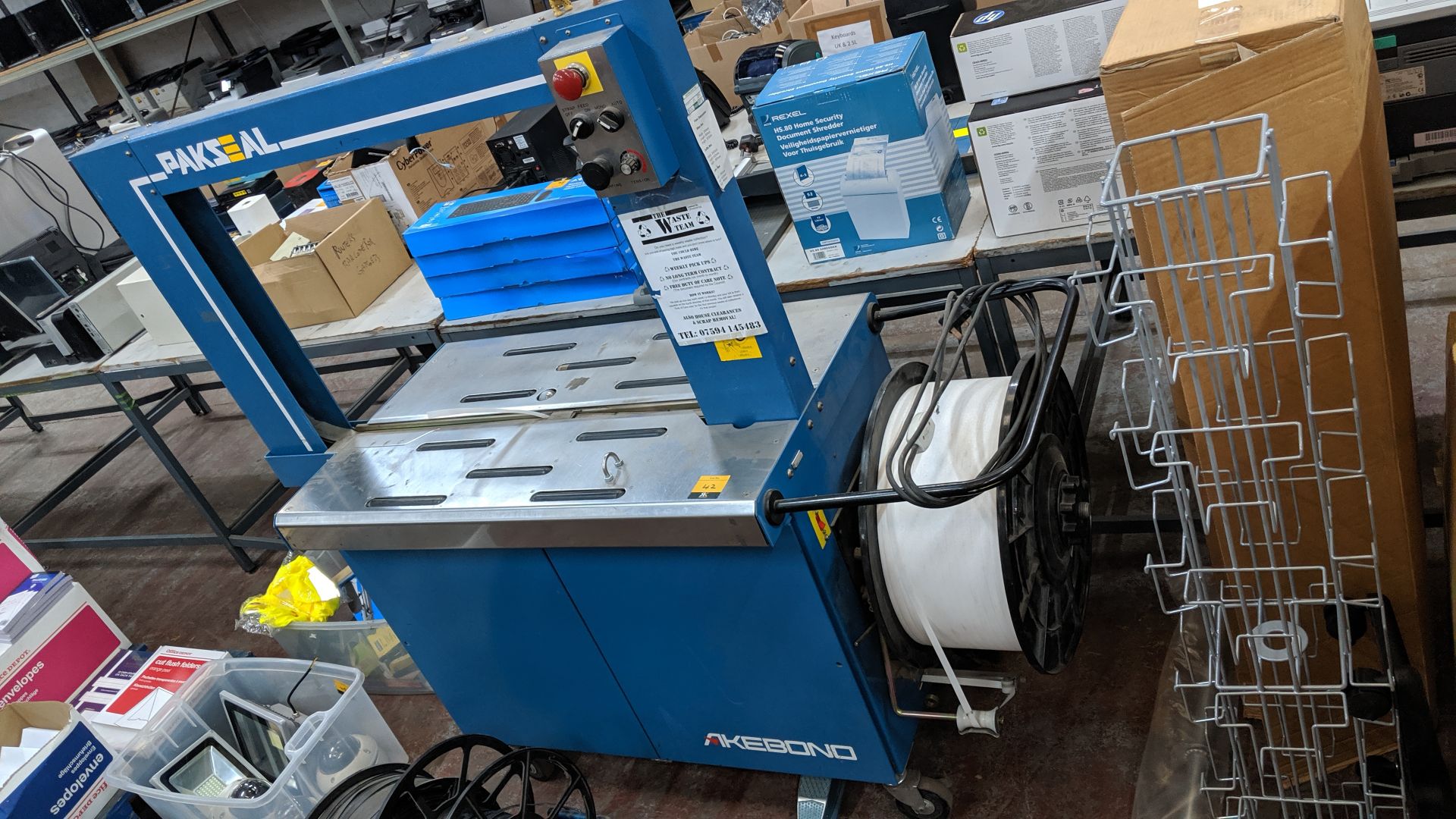 Akebono Pakseal model SX510 auto carton strapping banding machine, includes reel of banding on the