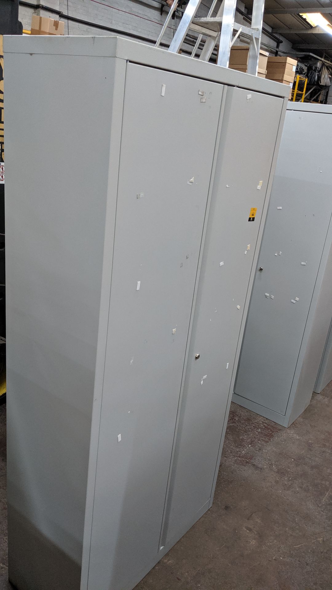 Pale grey metal stationery cupboard measuring approx. 77" (h) x 16" (d) x 36" (w) - with key. This - Image 3 of 3