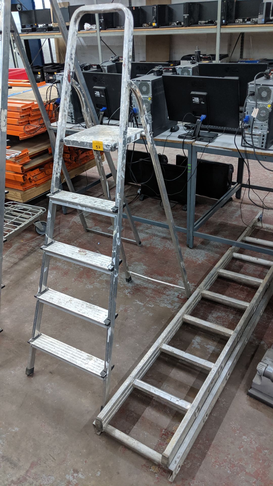 Stepladders plus 2 small rung ladders. This is one of a number of lots being sold on behalf of the