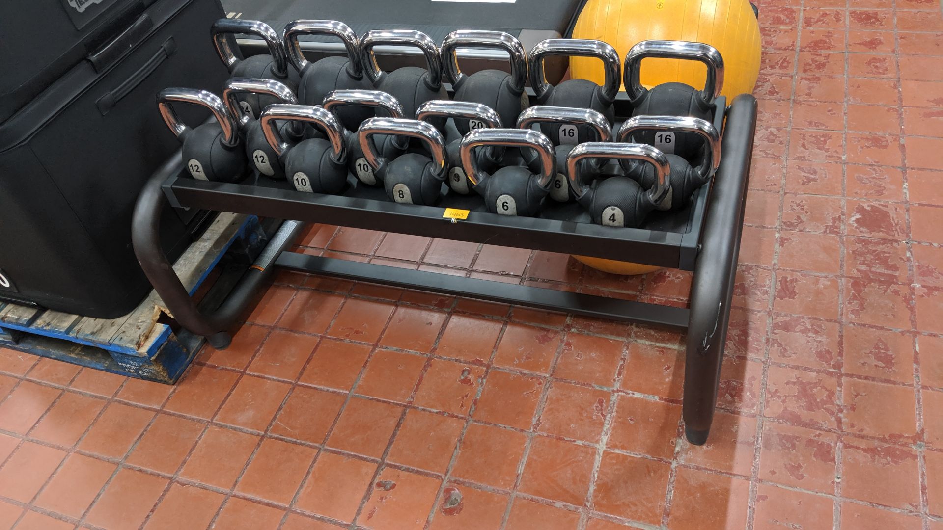 Quantity of Technogym kettlebells and heavy-duty stand for use with same - there are 8 pairs of