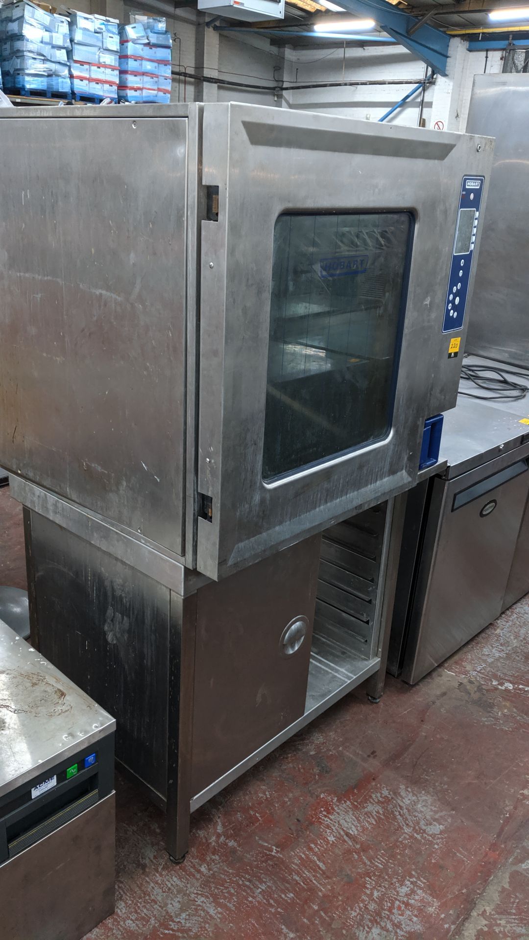 Hobart oven on dedicated stand incorporating tray holding section. IMPORTANT: Please remember