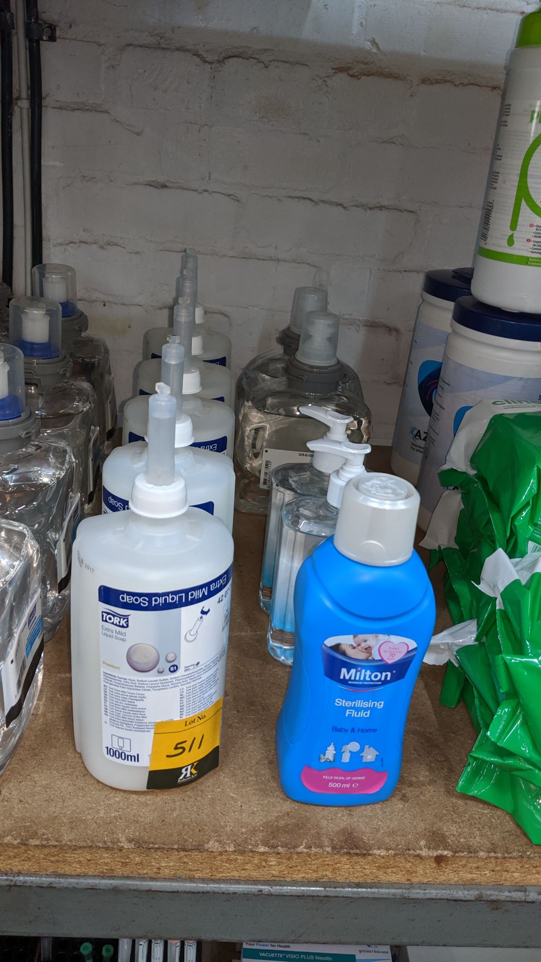10 assorted sized bottles of sterilizing fluid, liquid soap & similar. This is one of a large number