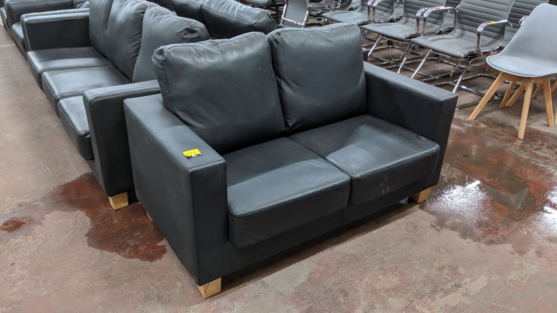 Pair of black leather-look sofas, comprising 1 off 2-seater & 1 off 3-seater. This is one of a large - Image 3 of 6