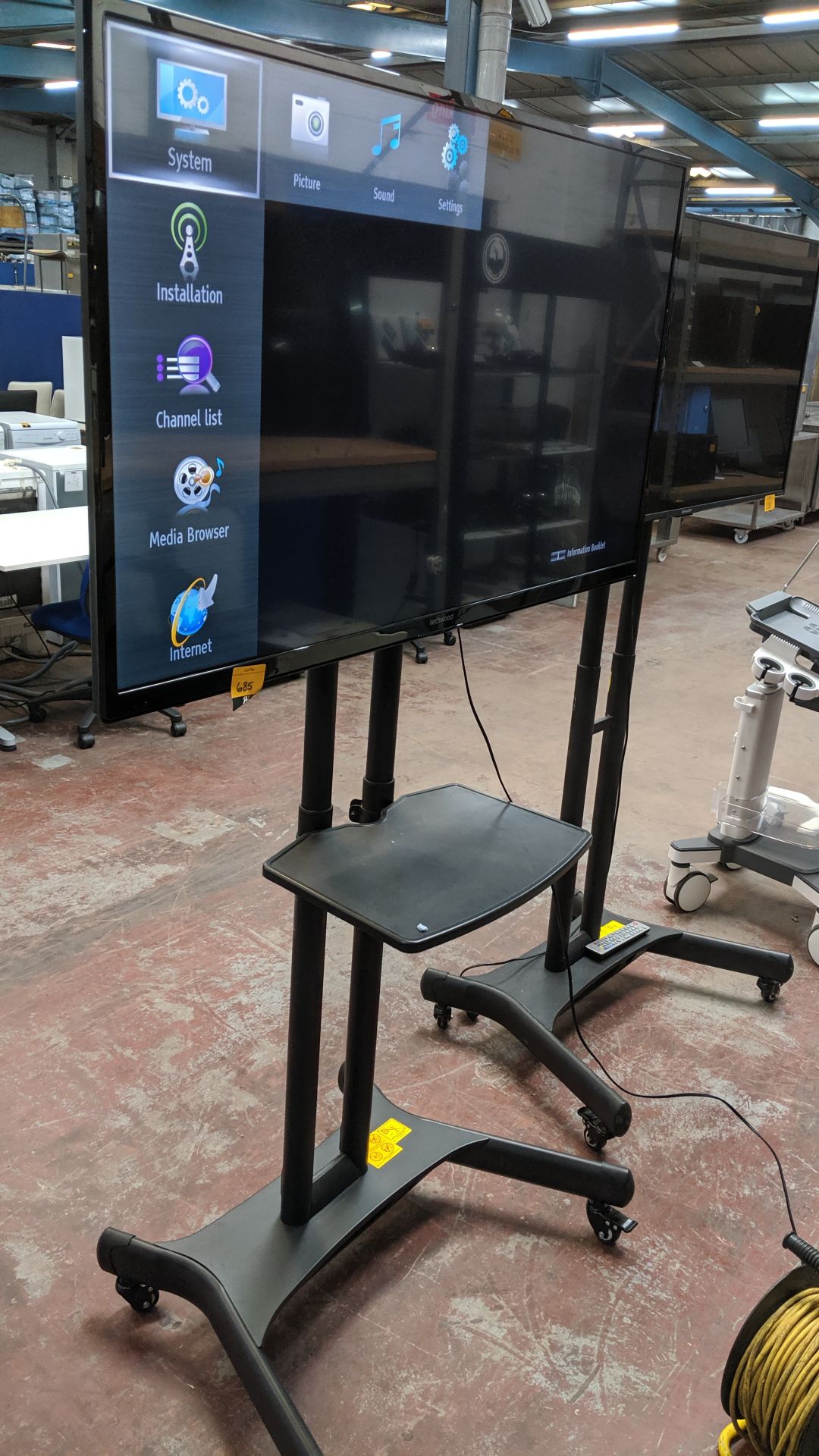 Techwood 49" widescreen LCD TV on mobile stand including shelf & remote control. This is one of a - Image 10 of 11