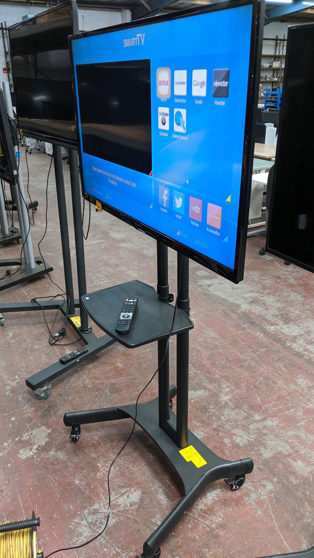 Techwood 49" widescreen LCD TV on mobile stand including shelf & remote control. This is one of a - Image 4 of 11