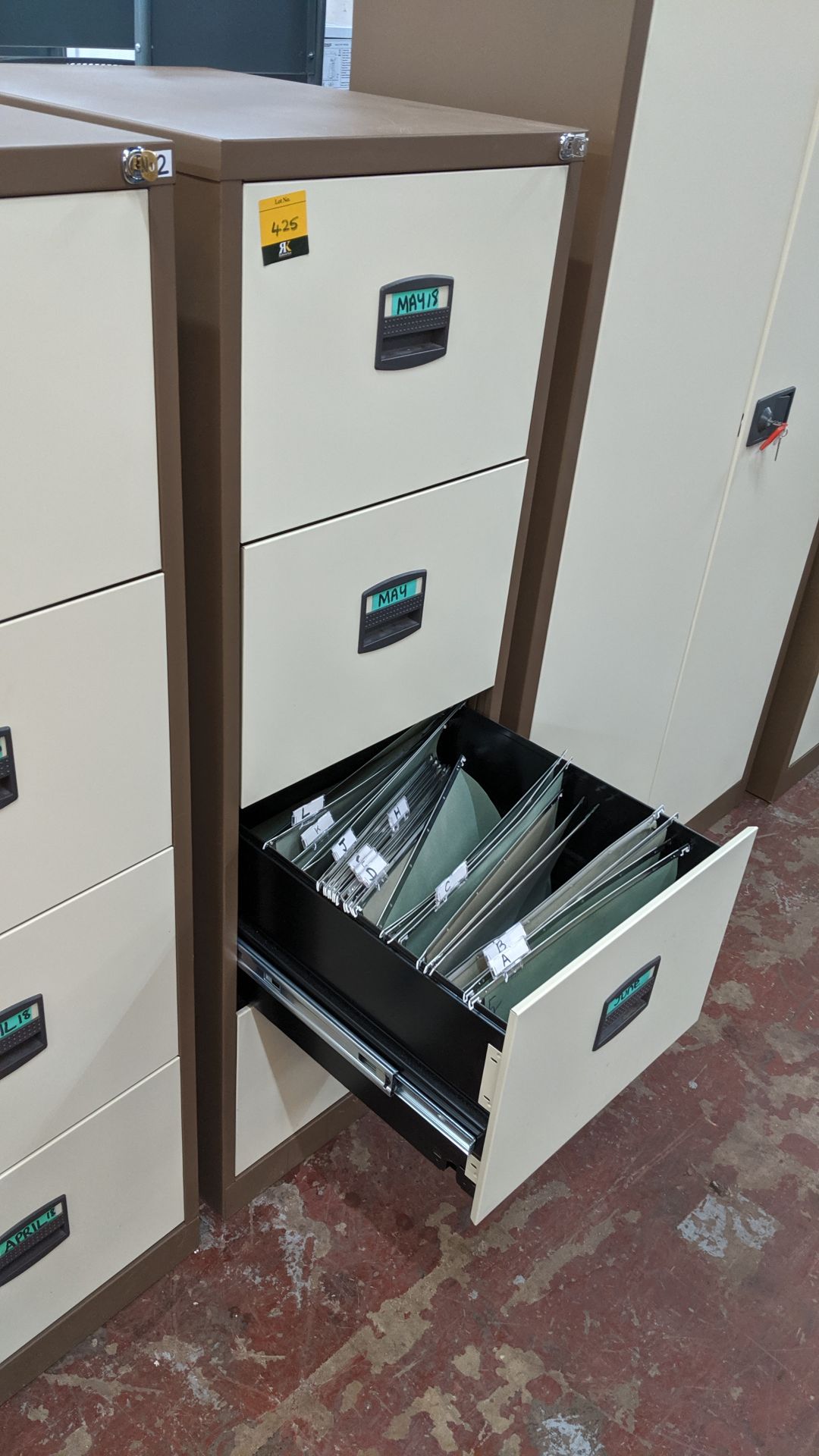 Brown metal 4-drawer filing cabinet with key. This is one of a large number of lots used/owned by - Image 4 of 4