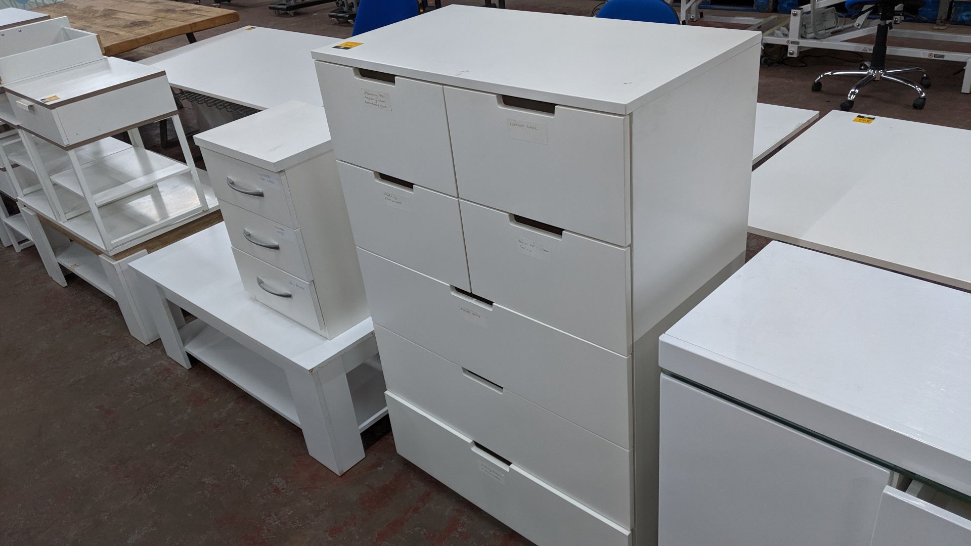 White furniture comprising large chest of drawers plus small pedestal & coffee/occasional table.