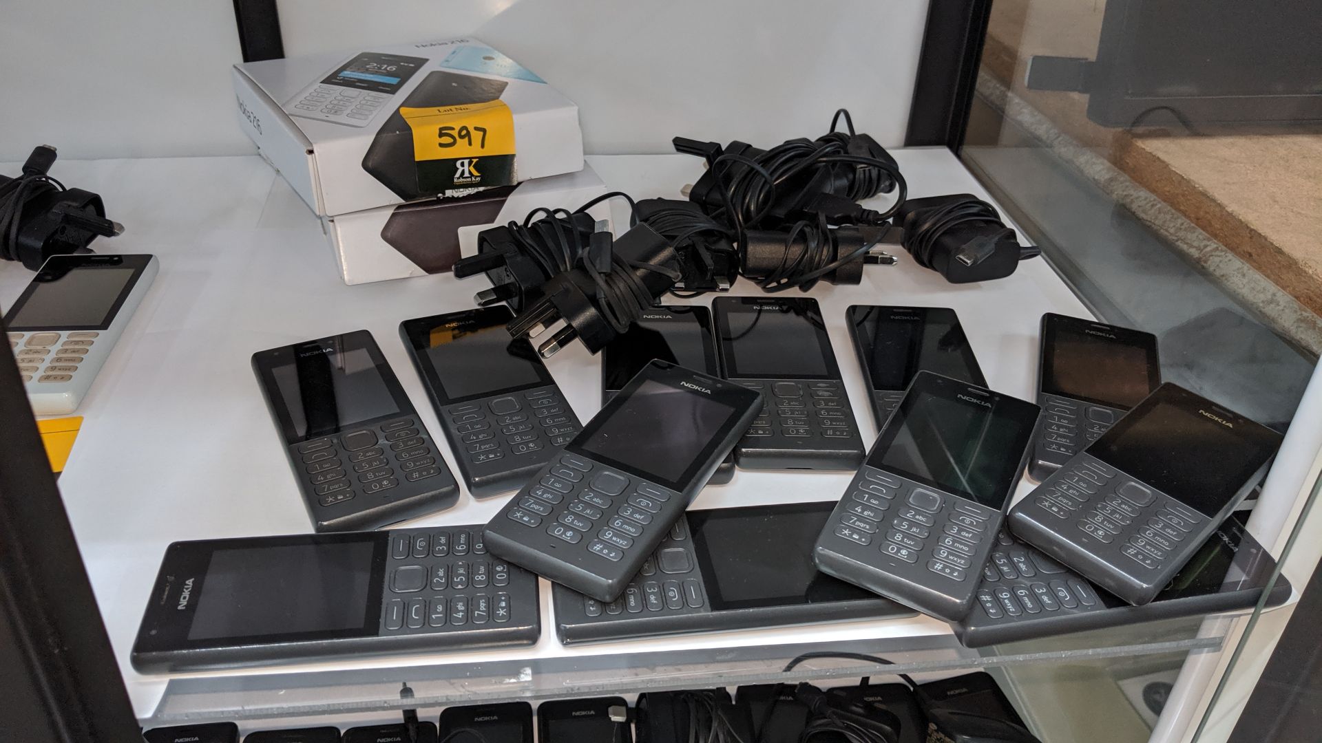 12 off Nokia 216 black mobile phones including 7 chargers & 2 boxes. We believe these phones were