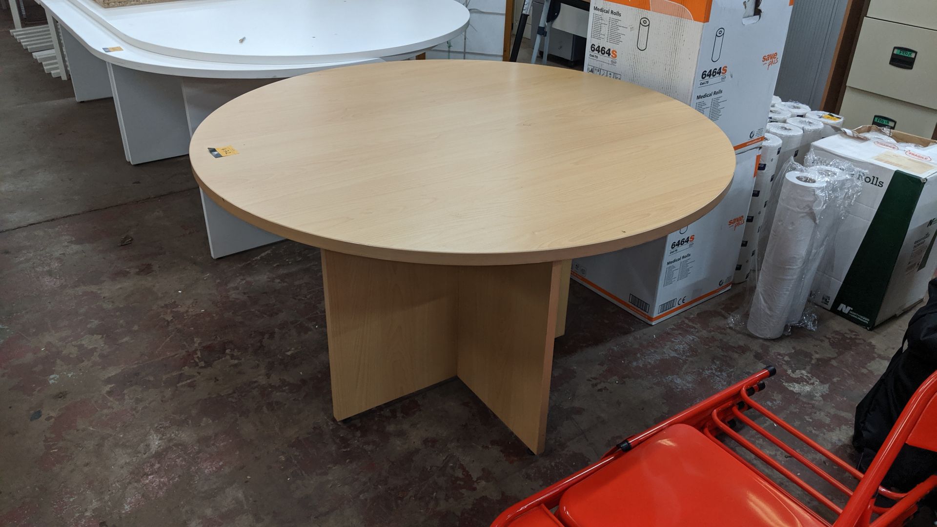 Round wooden meeting table. This is one of a large number of lots used/owned by One To One (North