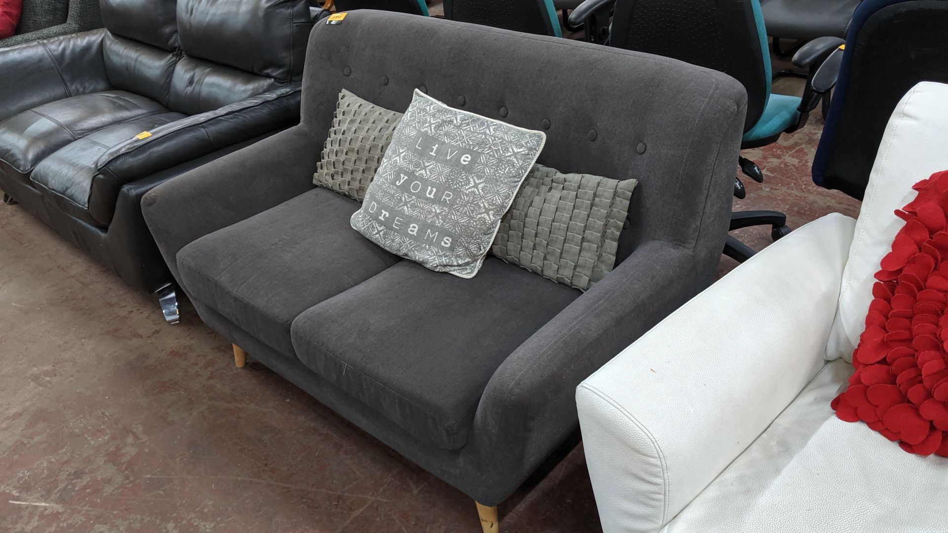 Grey sofa on wooden legs with 3 assorted cushions. This is one of a large number of lots used/ - Image 2 of 5