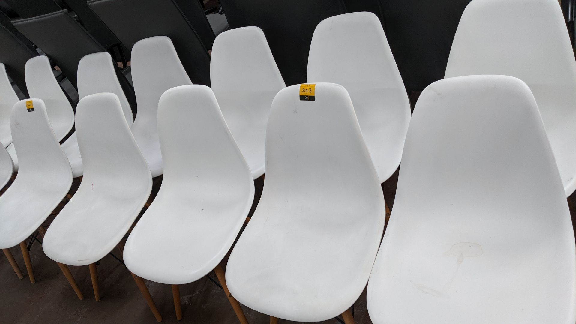 6 off white chairs with wooden legs NB. Lots 342 - 344 consist of different quantities of the same