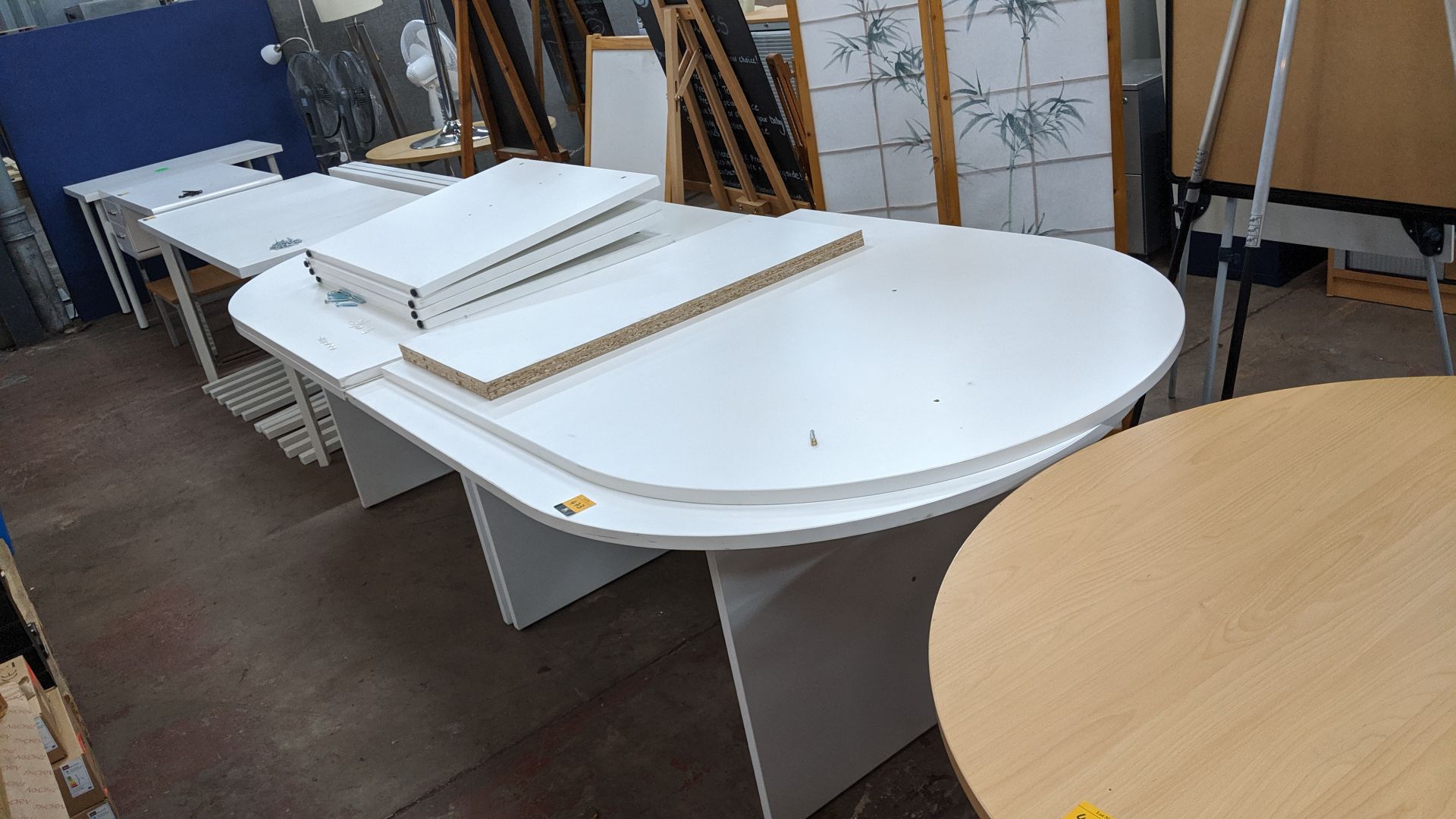 Pair of large oval meeting tables, one assembled & one unassembled, max. dimensions of complete