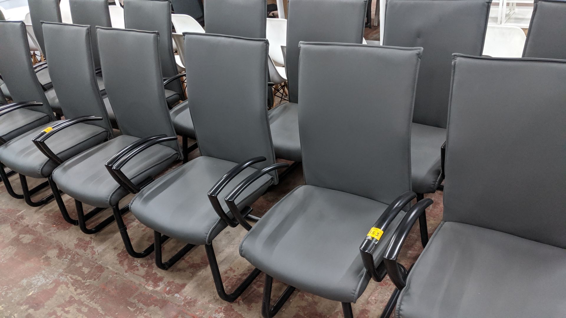 6 off black metal cantilever framed executive/meeting chairs with grey leather-look upholstery NB.