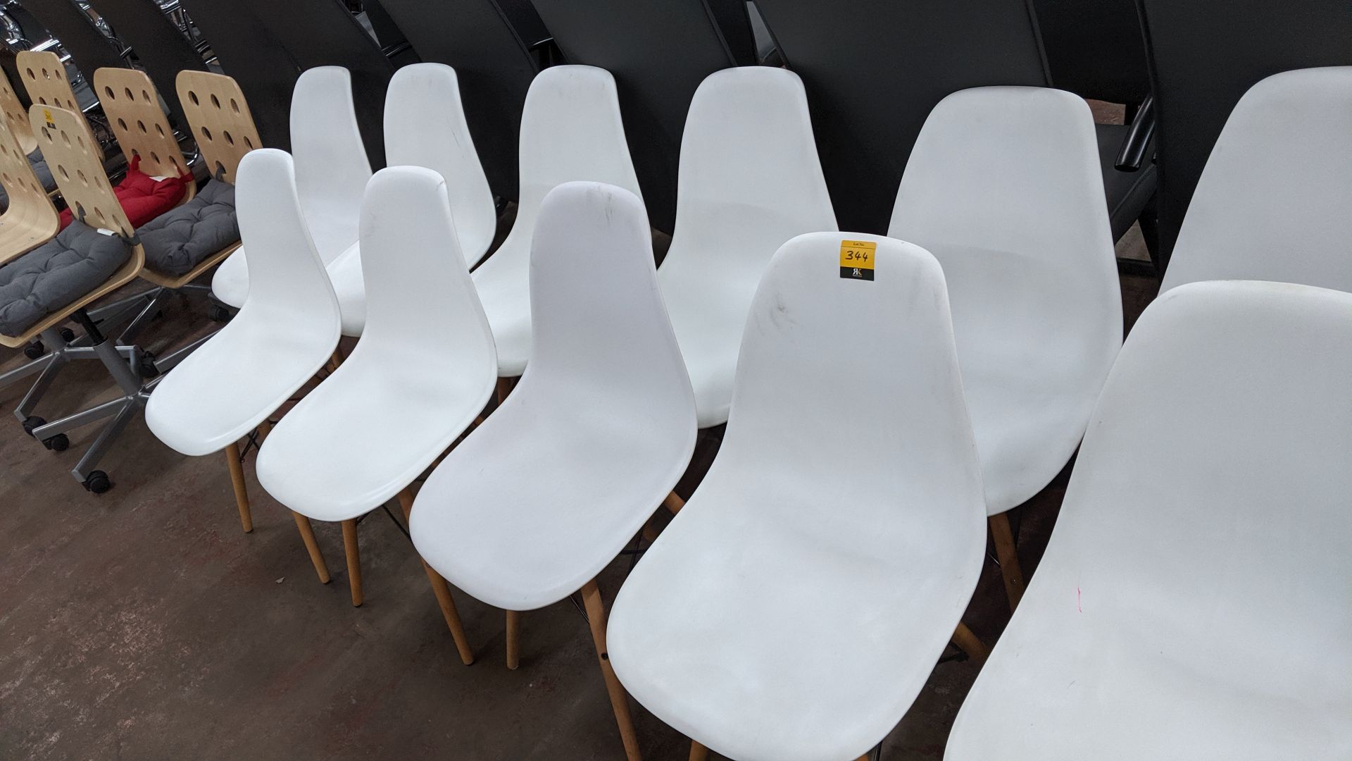 9 off white chairs with wooden legs NB. Lots 342 - 344 consist of different quantities of the same