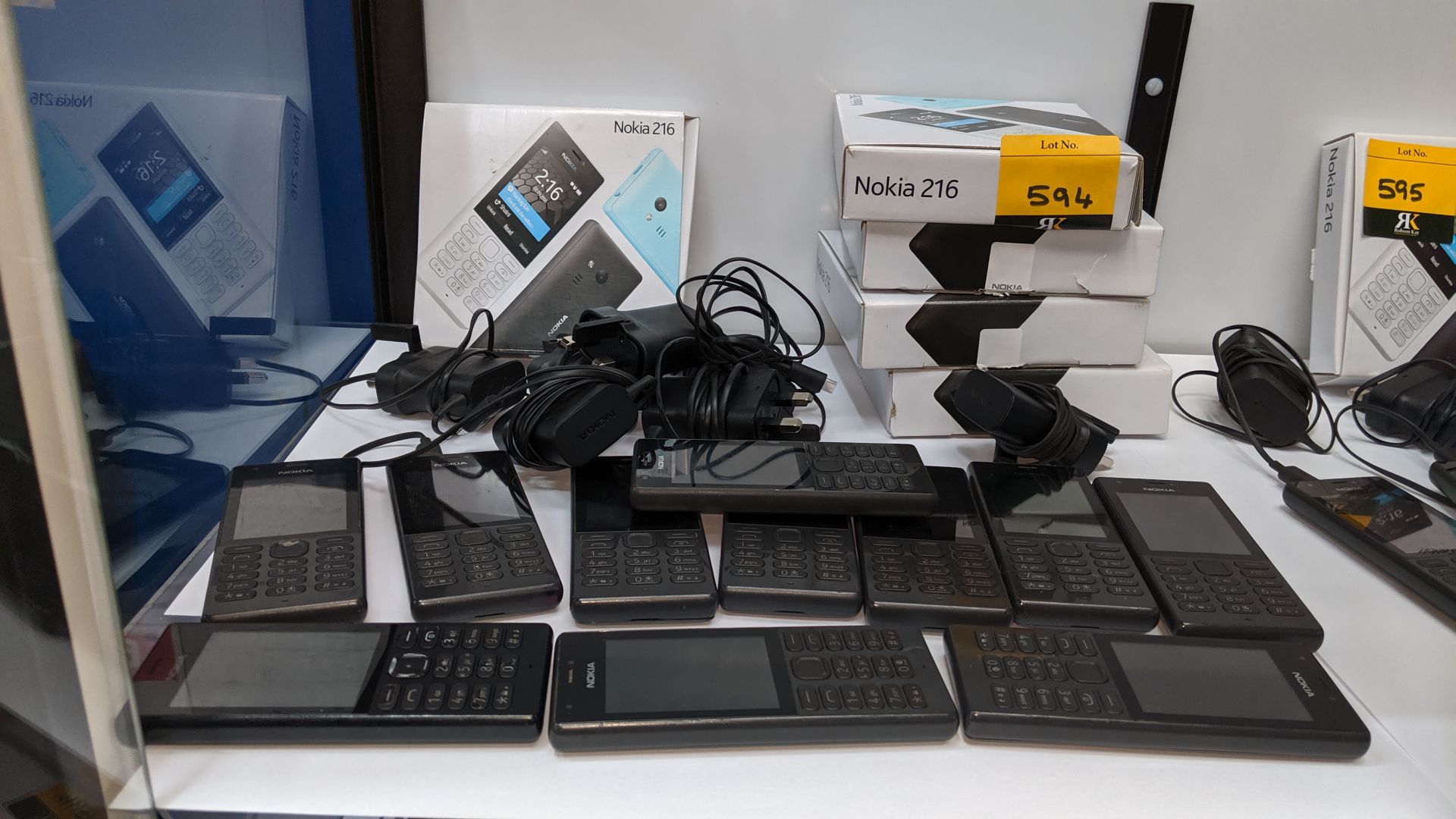 11 off Nokia 216 black mobile phones including 7 chargers & 5 boxes. We believe these phones were
