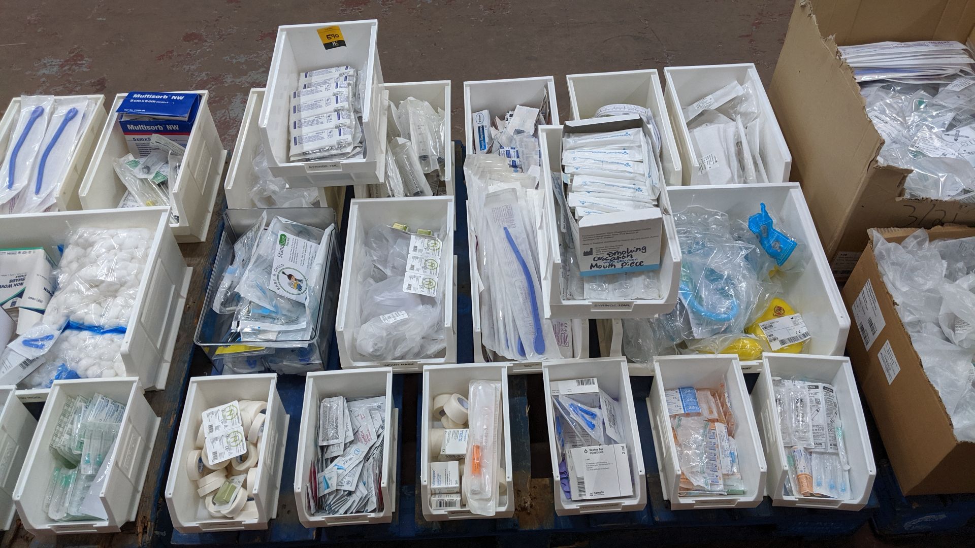 Contents of a pallet of medical supplies consisting of a large quantity of plastic bins & their