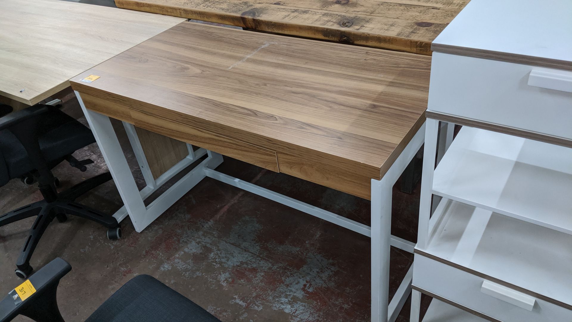 White & wooden finish desk. This is one of a large number of lots used/owned by One To One (North