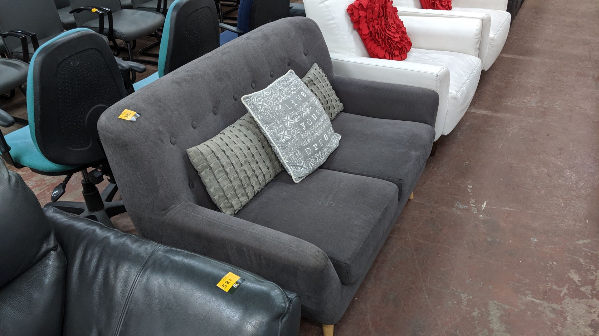 Grey sofa on wooden legs with 3 assorted cushions. This is one of a large number of lots used/ - Image 4 of 5