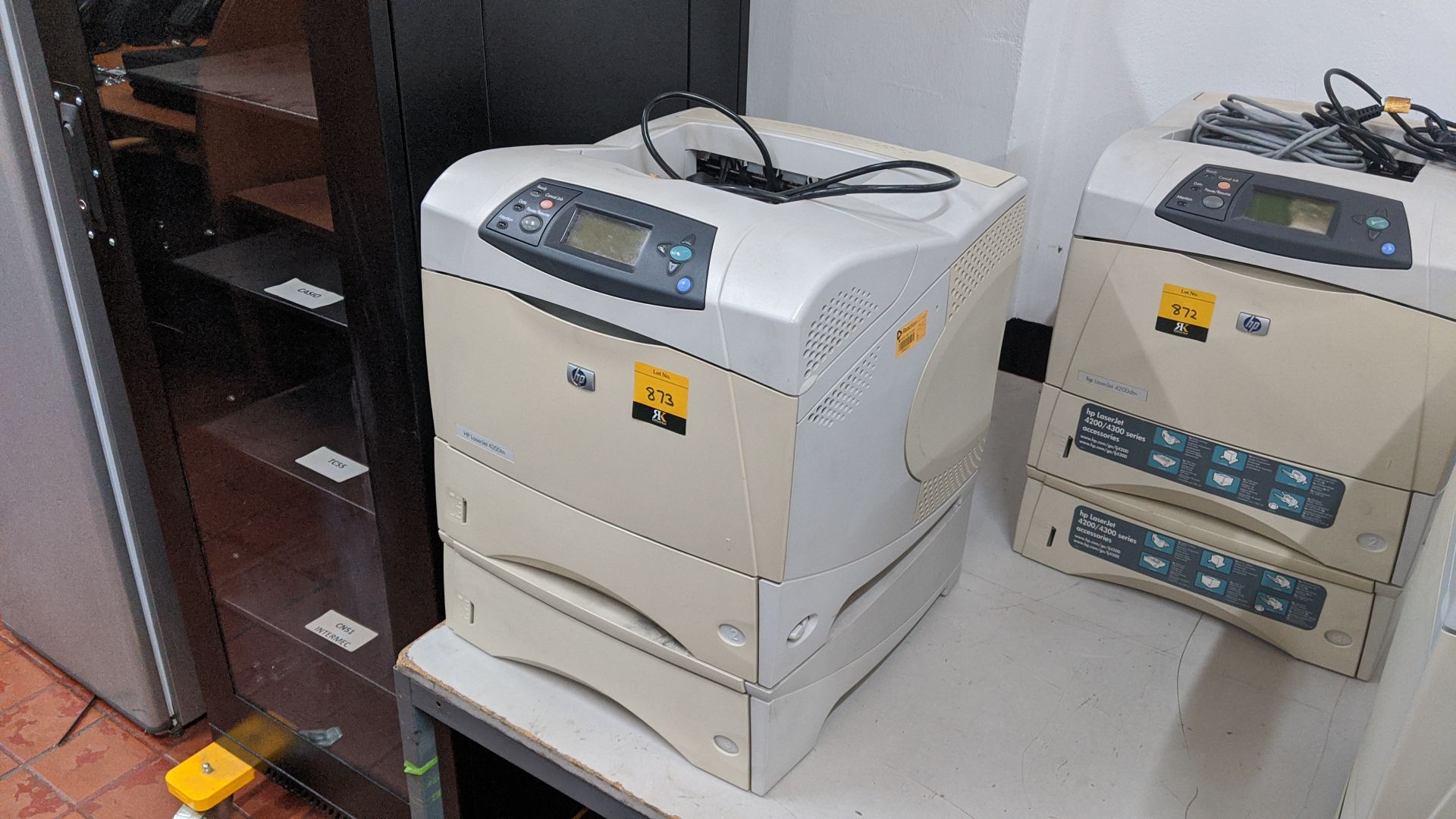 HP LaserJet 4350TN printer including a total of 2 paper cassettes. This is one of a large number