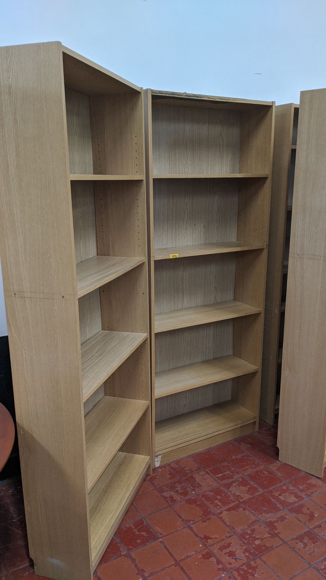 2 off tall wooden open front bookcases. This is one of a large number of lots in this sale being