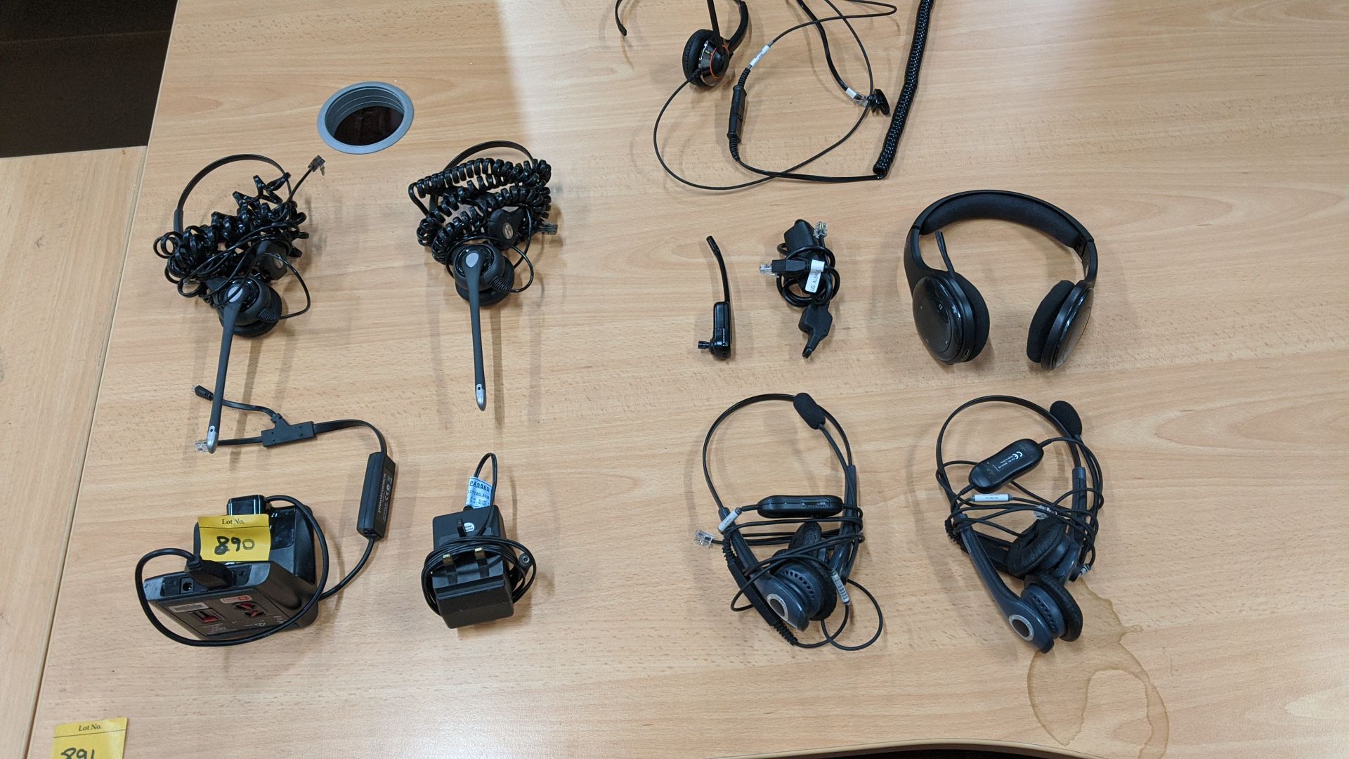 Quantity of telephone headsets & related equipment. This is one of a large number of lots in this