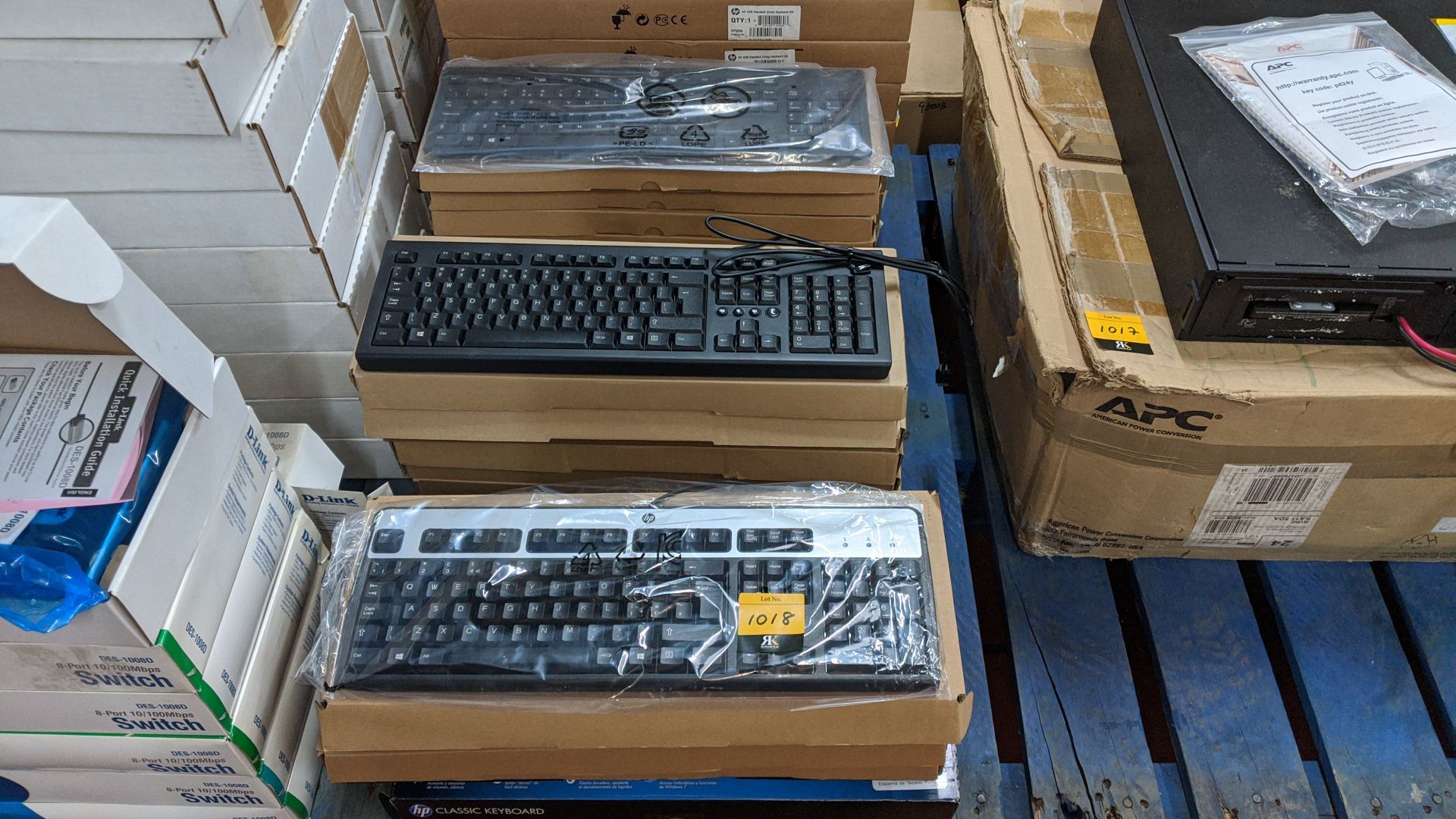 Approximately 23 assorted computer keyboards in 3 stacks. This is one of a large number of lots in