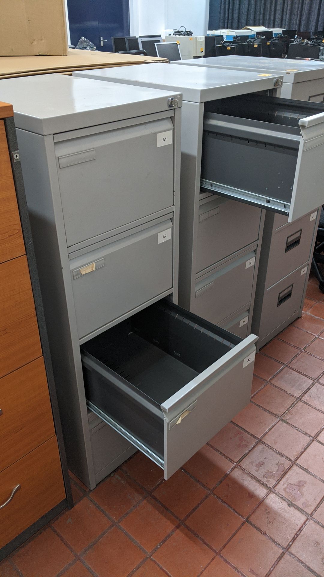 2 off matching pale grey metal 4-drawer filing cabinets with keys. This is one of a large number - Image 3 of 4