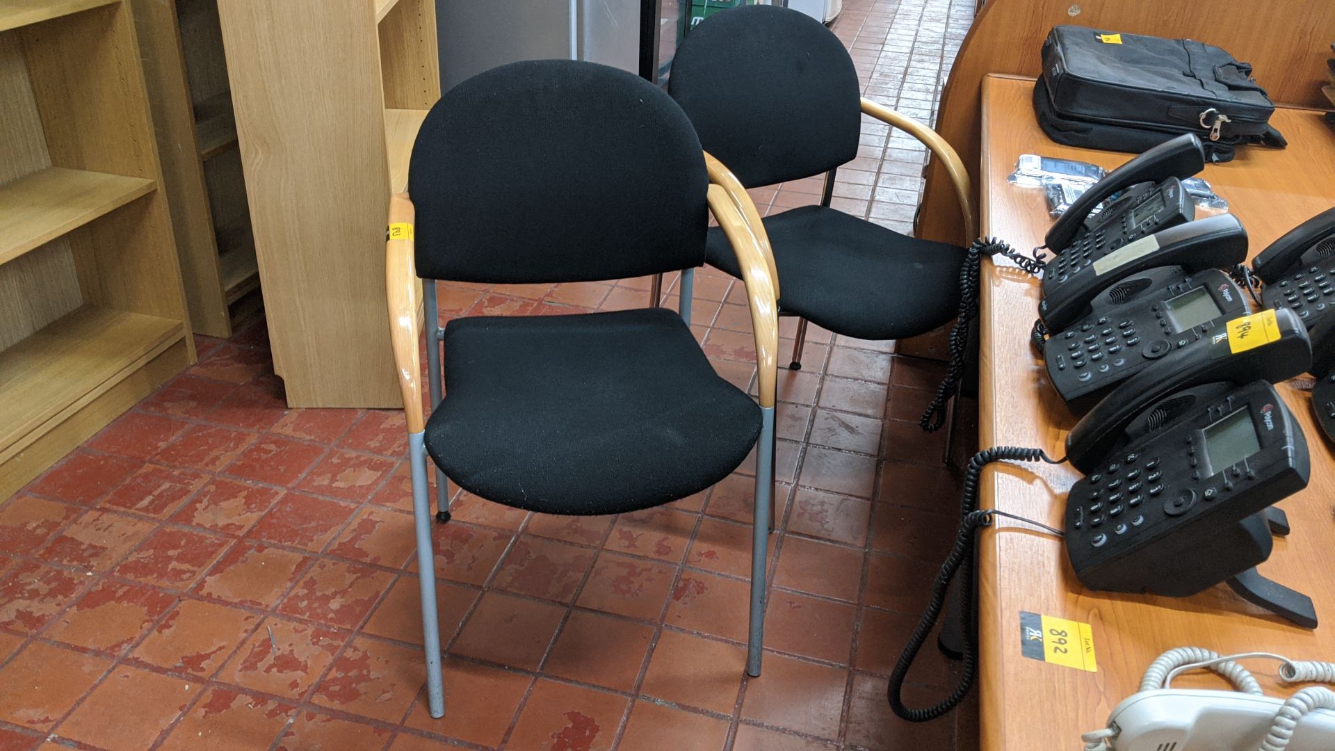 5 off chairs, 2 with chrome legs, 3 with metal grey legs, each with wooden arms & black